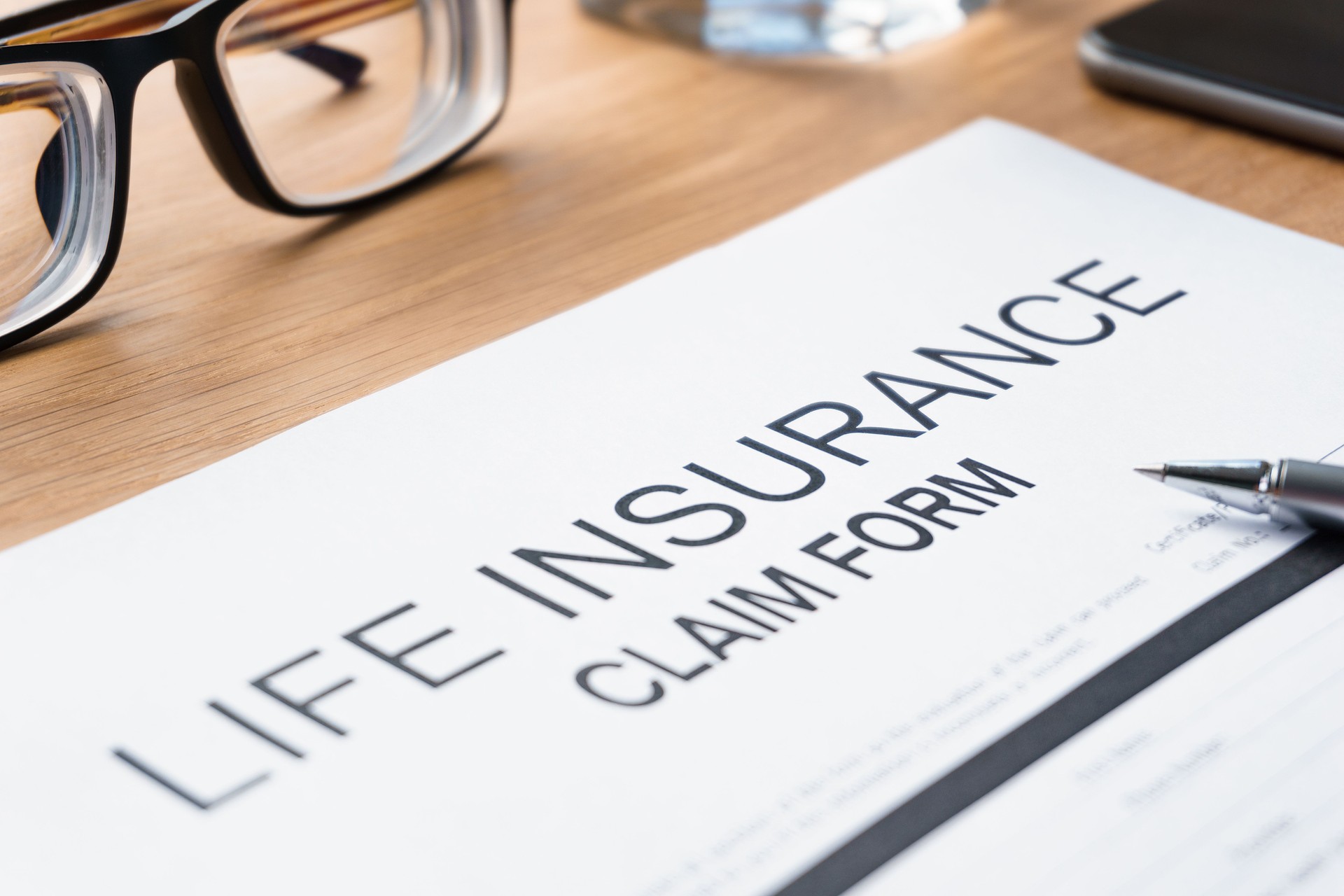 Life Insurance claim form on table